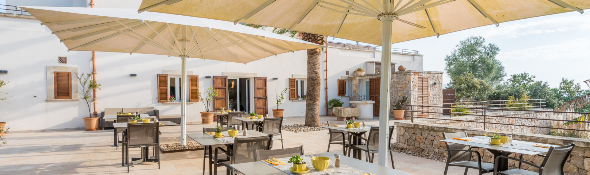 a patio with tables and chairs