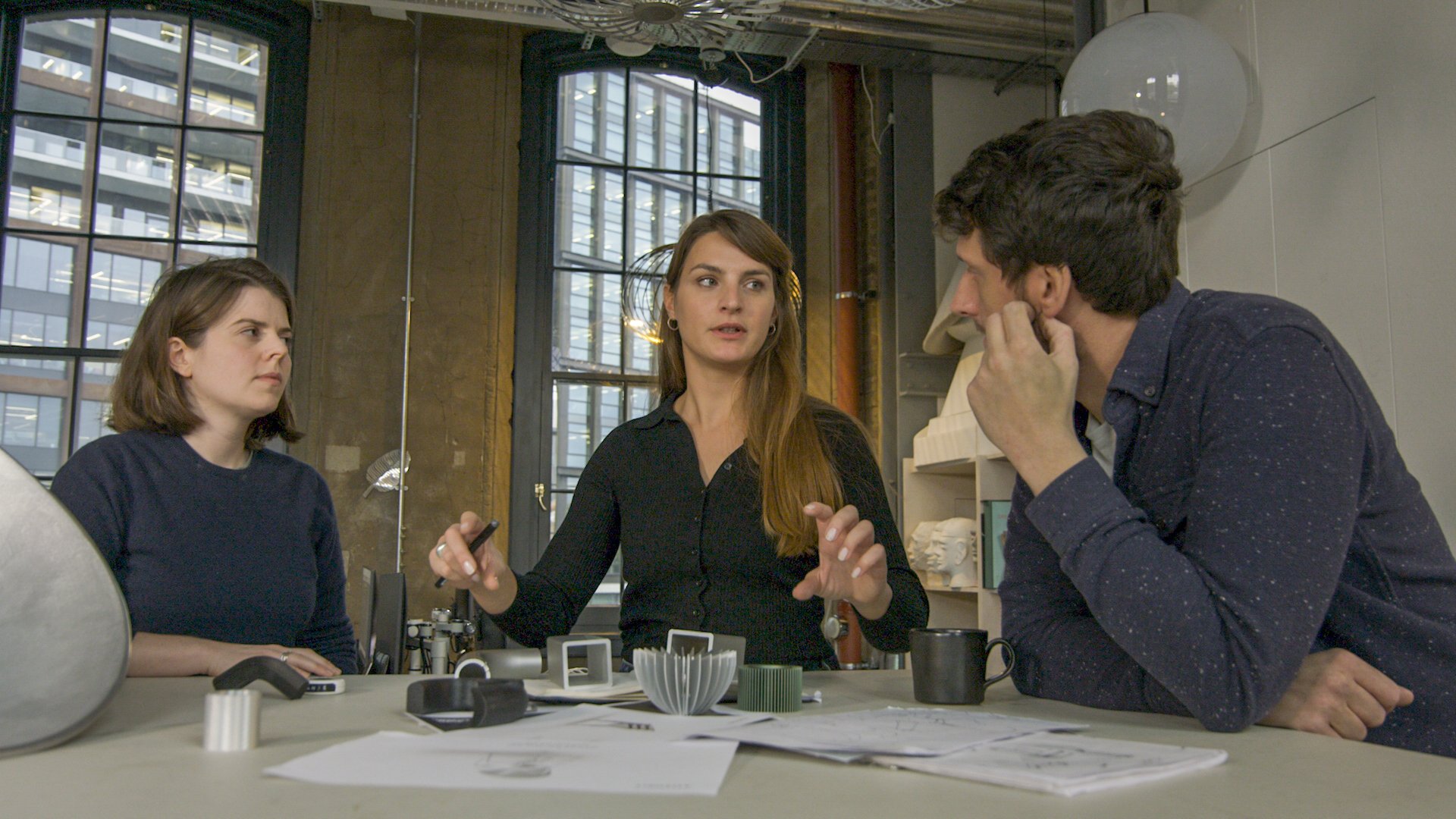 a group of people sitting at a table