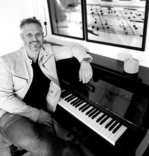a person sitting at a piano