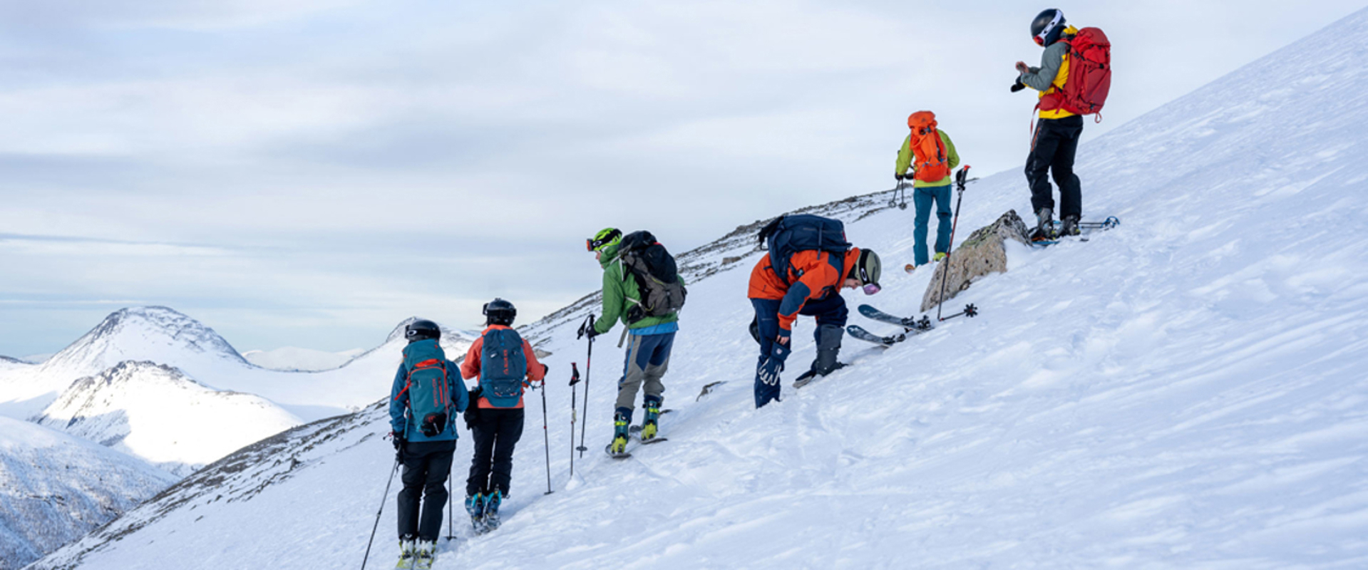 a group of people on a snowy mountain