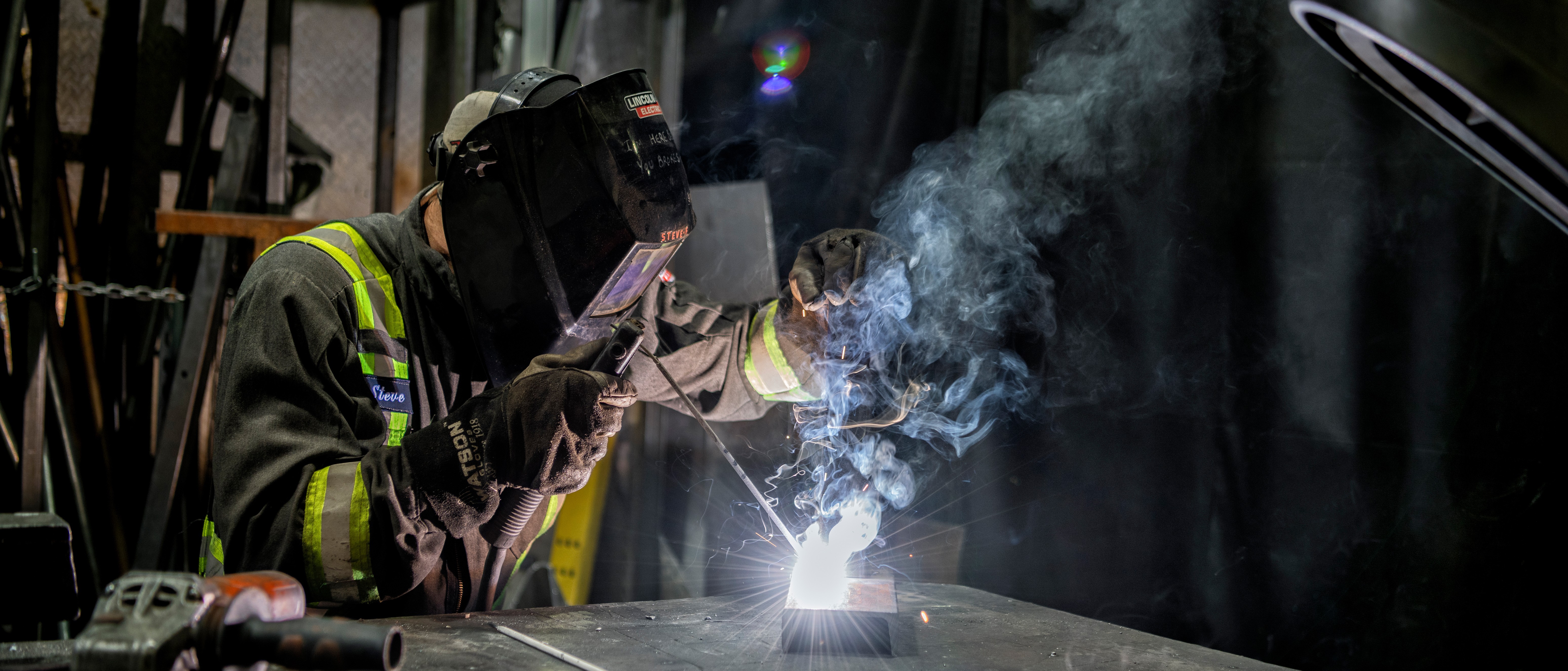 a person welding a piece of metal
