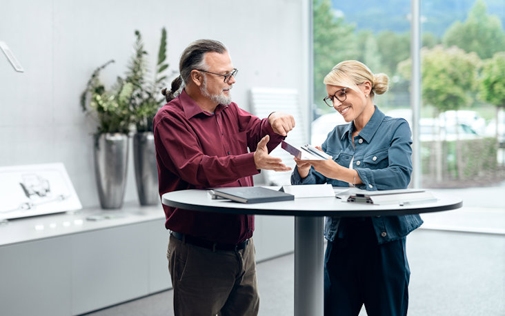a man and a woman looking at a tablet a man and a woman looking at a tablet