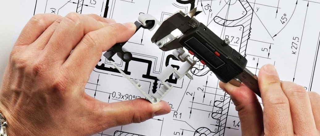 An engineer designing an extrusion profile. An engineer designing an extrusion profile.