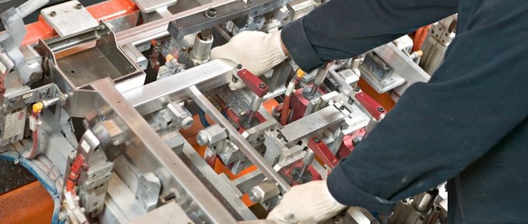 a man working on a machine a man working on a machine