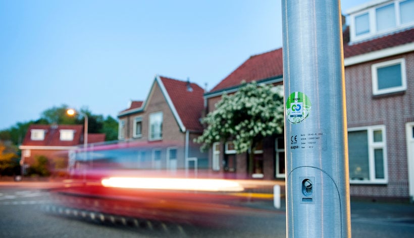 traffic pole, road, residential houses