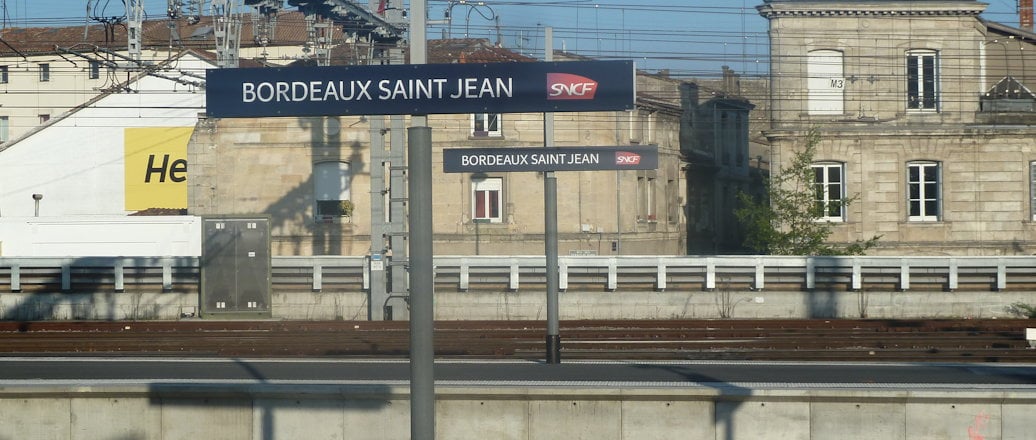 railway station. poles holding cables and lights