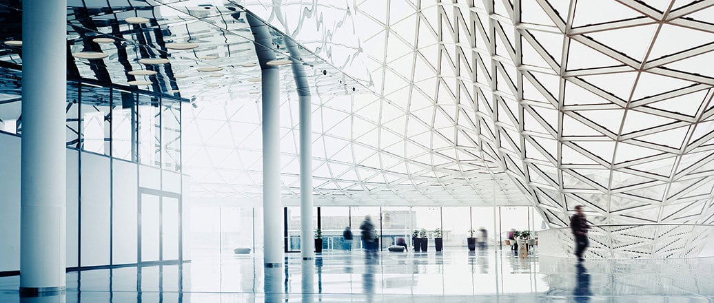 interior of a large building with huge glass windows in triangular sections interior of a large building with huge glass windows in triangular sections