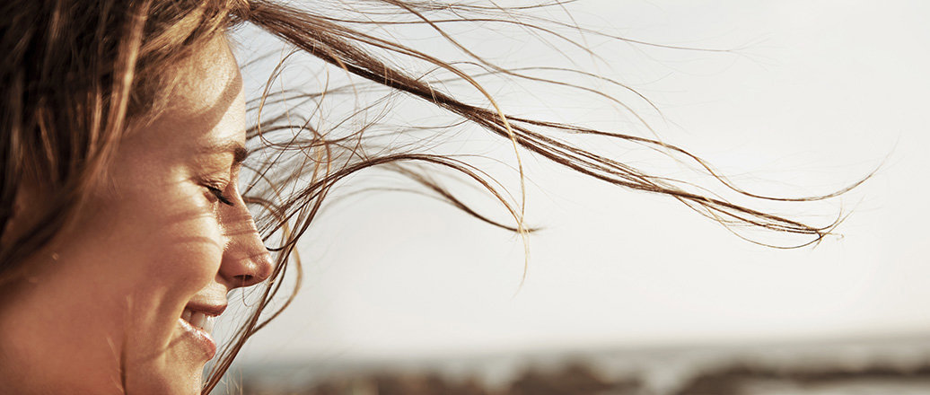 womain with long hair blowing in the wind