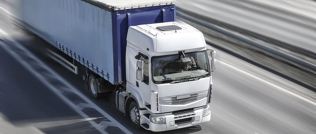 heavy duty truck moving on highway