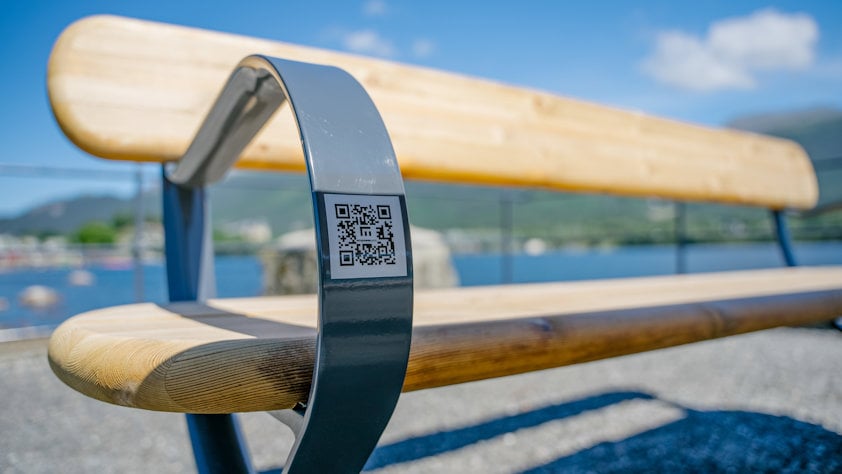 A bench with a QR code on it A bench with a QR code on it