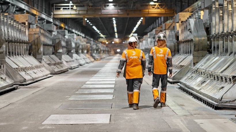 men in safety vests in a factory men in safety vests in a factory