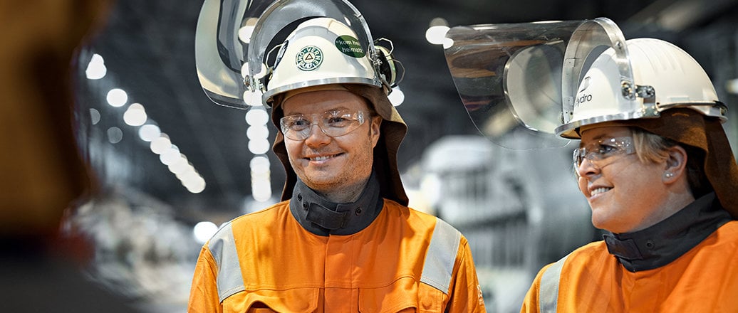 a few men wearing hard hats