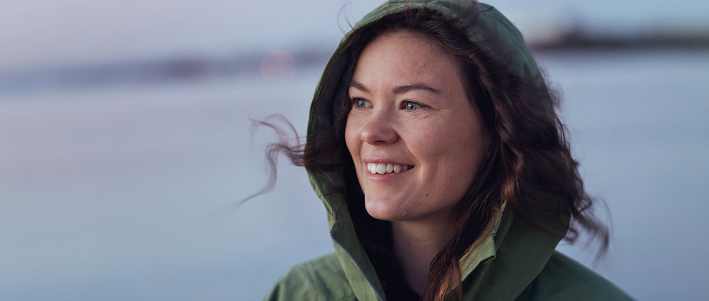 a woman with long hair smiling a woman with long hair smiling
