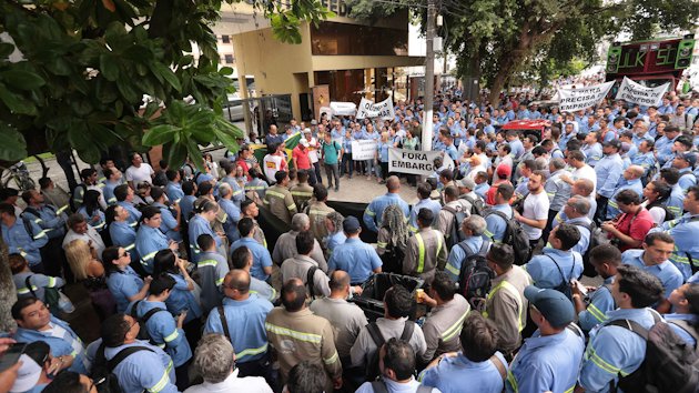 A large group of people in Hydro work gear gathered for a demonstration