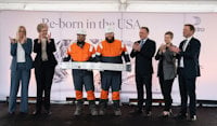 The state-of-the-art aluminium recycling plant was officially opened on Thursday, November 16. From left: Emilie LaGrow, Village Manager Cassopolis, Hilde Merete Aasheim, President & CEO Hydro, Dre Kiser, Production Operator, Tyler First, Production Operator, Tore Onshuus Sandvik, State Secretary Labour Party, Jen Nelson, Chief Operating Officer, Michigan Economic Development Corporation and Eivind Kallevik, Executive Vice President Hydro Aluminium Metal. Dre and Tyler, who have known each other since first grade, are holding a bumper beam for cars made with recycled aluminium.