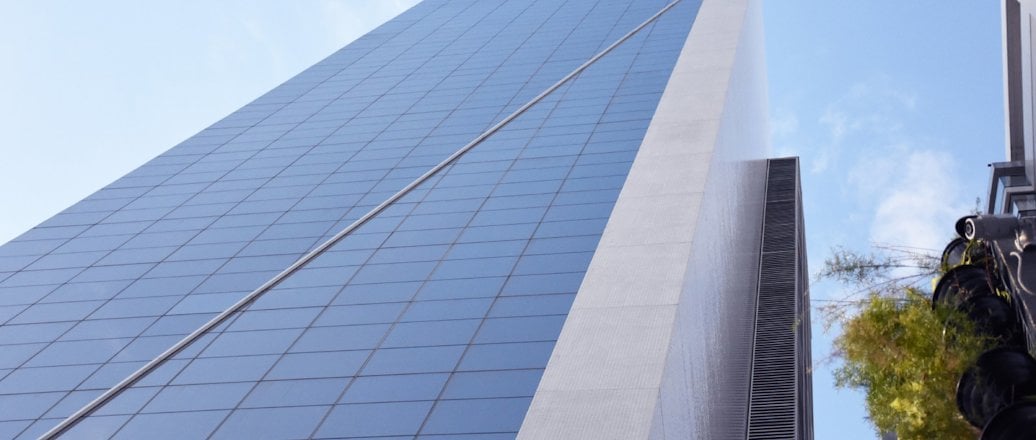 Tall glass covered building, housing the Hydro belem office