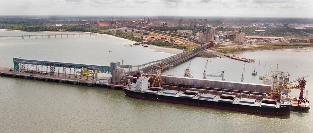 Ship on the Vila do Conde Port. Alunorte refinery is behind.